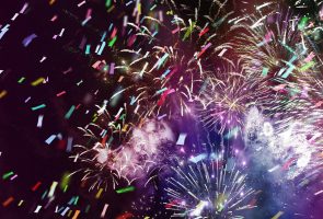 multicolor fireworks and ticker tapes stars and lights pattern of bright colorful fireworks with colorful stars and circle and ticker tapes shapes added